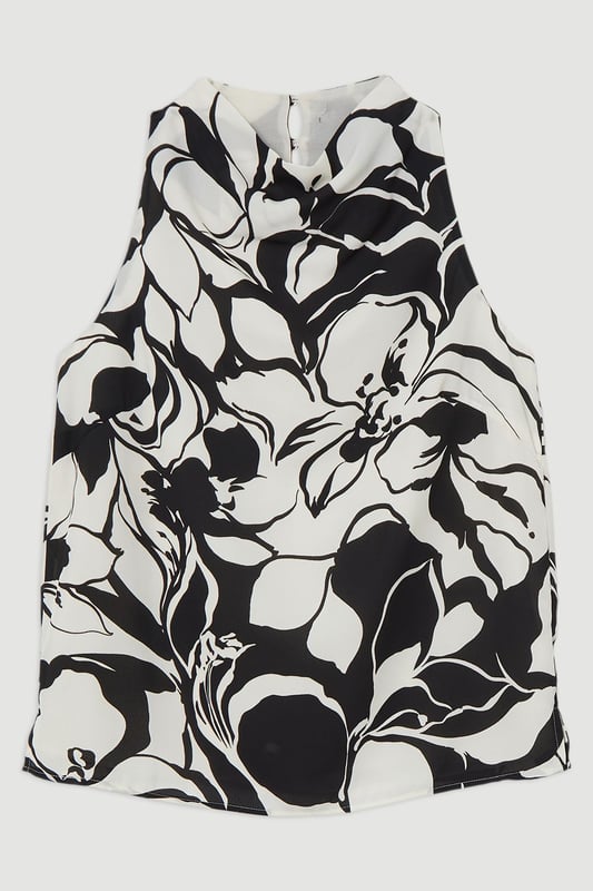 Experience elevated top options in our cowl neck shirt, featuring a striking, monochromatic pattern and a cowl neckline. Pair it with tailored trousers or jeans and boots or strappy heels for all eventualities. Tall Printed Cowl Halter Neck Woven Top Striking Marbled Pattern Formal, Cowl Style High Neckline Comfortable, Relaxed Fit Button Fastening Behind NeckBrowse this seasons women's work tops or discover the full range of workwear now.