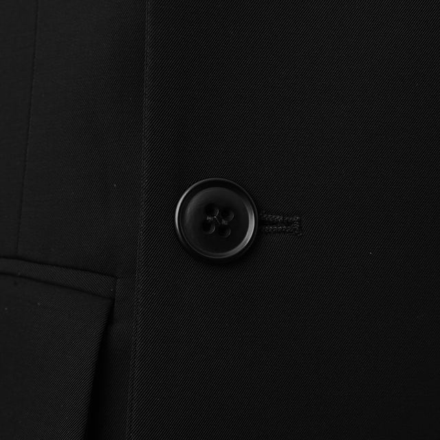 100% viscose. Fluid twill enhances the elegant drape of Raey's black Dream jacket, shaped to a characteristically generous frame with structured shoulders and peaked lapels.