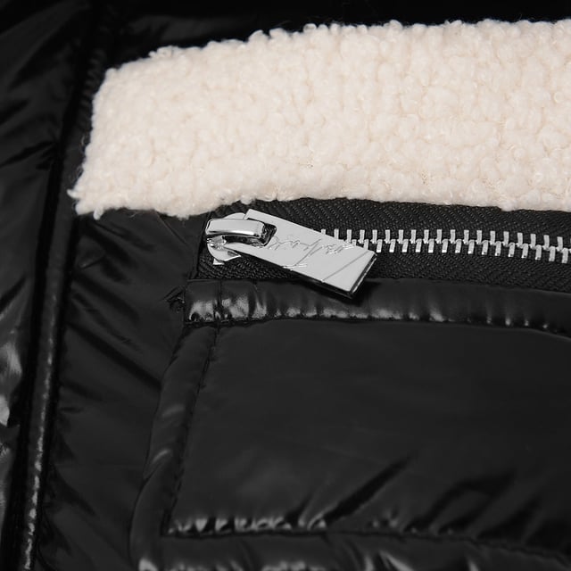 Details: 

- Reversible zip through jacket with hood
- Contrast outer fabrics - soft faux fur fabric and a high shine technical fabric on the reverse, can be worn two ways
- Tonal zip front fastening with branded metalwear
- Applique tonal emblem logo to front chest, with embroidery tonal logo to reverse front chest
- Pocket detail with concealed zip fastening to front 
- Elastic drawcords with branded adjusters and eyelets at hem