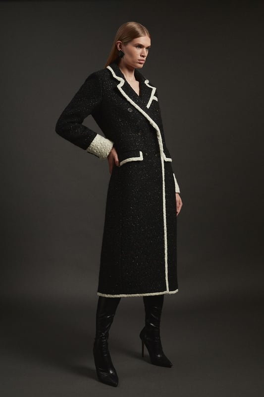 Feel elevated no matter the weather in our midi length coat, featuring a traditional, double breasted design, and contrasting trim details. Wear it over any outfit, whether heading out for dinner or to the office. Texture Metallic Contrast Tipped Double Breasted Tailored Midi Coat Flattering Straight Silhouette Classic Double Breasted Design V Neckline Unique Cape Accent Contrast Detailing Midi LengthShop this seasons women's long coats and jackets or browse the full collection of coats and jackets now.