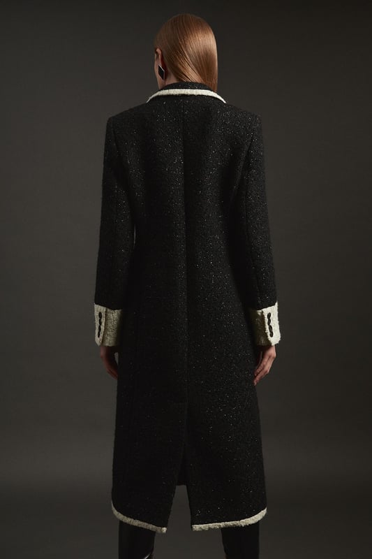 Feel elevated no matter the weather in our midi length coat, featuring a traditional, double breasted design, and contrasting trim details. Wear it over any outfit, whether heading out for dinner or to the office. Texture Metallic Contrast Tipped Double Breasted Tailored Midi Coat Flattering Straight Silhouette Classic Double Breasted Design V Neckline Unique Cape Accent Contrast Detailing Midi LengthShop this seasons women's long coats and jackets or browse the full collection of coats and jackets now.
