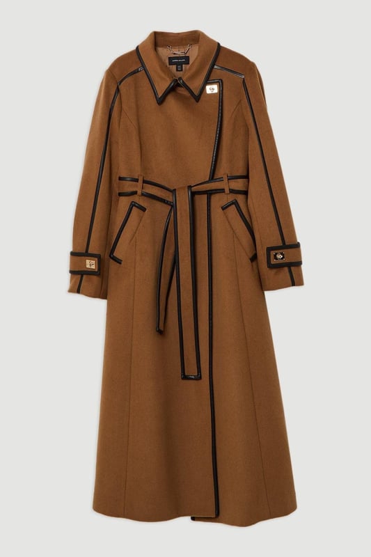 Feel elevated no matter the weather in our plus size midi length coat, made in high quality, thick wool, featuring a fit that flatters the figure and faux leather trims. Wear it over any outfit, whether heading out for dinner or to the office. Plus Size Wool Blend Faux Leather Trim Belted Tailored Midi Coat High Quality Wool Blend Fabric Flattering Fitted Bodice Straight Hanging Skirt Metallic Clasp Buttons at Collar and Cuffs High, Collared Neckline Belted Waistline Unique, Faux Leather Trims Expertly designed for those UK size 18/US size 14 and above, our plus size clothing collection is perfectly proportioned to ensure you look stylish at every shape. Discover our collection of plus size coats and jackets or browse our range of plus size clothing now.