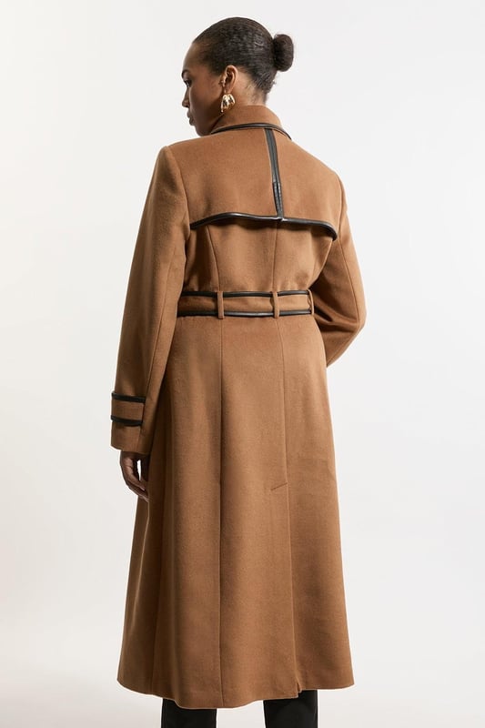 Feel elevated no matter the weather in our plus size midi length coat, made in high quality, thick wool, featuring a fit that flatters the figure and faux leather trims. Wear it over any outfit, whether heading out for dinner or to the office. Plus Size Wool Blend Faux Leather Trim Belted Tailored Midi Coat High Quality Wool Blend Fabric Flattering Fitted Bodice Straight Hanging Skirt Metallic Clasp Buttons at Collar and Cuffs High, Collared Neckline Belted Waistline Unique, Faux Leather Trims Expertly designed for those UK size 18/US size 14 and above, our plus size clothing collection is perfectly proportioned to ensure you look stylish at every shape. Discover our collection of plus size coats and jackets or browse our range of plus size clothing now.