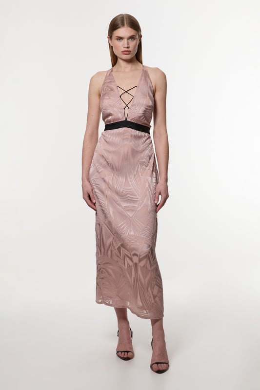 Architectural influences, brought to life through print; Karen Millen presents a new collection in collaboration with Amelia Graham. Elevate your occasion wear wardrobe with our occasion dress, with a figure hugging bodice which flows into a straight skirt, a halter neckline with strappy detailing, and a low back. Style it with strappy heels for an occasion look that is guaranteed to turn heads wherever you step. Amelia Graham Burnout Lace Up Detail Woven Column Dress High Quality Lace Fabric Figure Hugging Fit Straight Hanging Skirt Striking Strappy Back Lace-Up Bust Accent Belted Waistline Tie Back FasteningDiscover this seasons lace dresses or browse the full collection of women's dresses now.