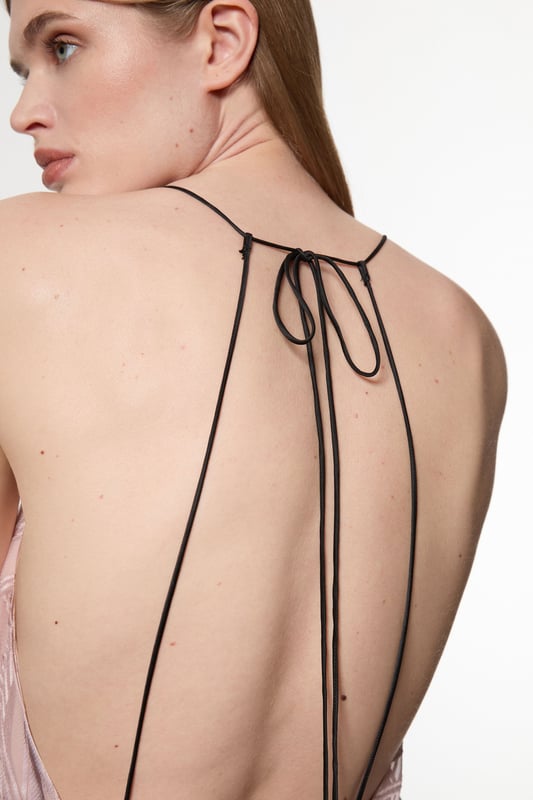Architectural influences, brought to life through print; Karen Millen presents a new collection in collaboration with Amelia Graham. Elevate your occasion wear wardrobe with our occasion dress, with a figure hugging bodice which flows into a straight skirt, a halter neckline with strappy detailing, and a low back. Style it with strappy heels for an occasion look that is guaranteed to turn heads wherever you step. Amelia Graham Burnout Lace Up Detail Woven Column Dress High Quality Lace Fabric Figure Hugging Fit Straight Hanging Skirt Striking Strappy Back Lace-Up Bust Accent Belted Waistline Tie Back FasteningDiscover this seasons lace dresses or browse the full collection of women's dresses now.