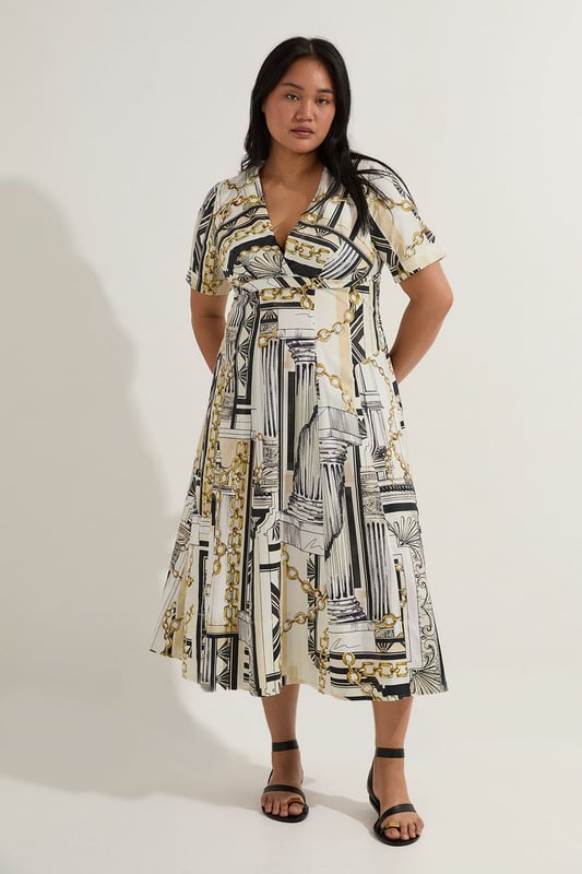Striking Roma print featuring architectural motifs and chain details Flattering V-neckline and short sleeves Full skirt design for a dramatic silhouette Midi length perfect for various occasions Crafted from soft cotton sateen for comfort and style  Make a statement in this eye-catching Karen Millen plus size midi dress. The Roma print, adorned with architectural elements and chain motifs, creates a captivating visual impact. The V-neckline and short sleeves offer a flattering frame, while the full skirt adds a touch of drama to your ensemble. Perfect for daytime events, this dress can be styled with flat sandals and a tote bag for a casual lunch date or family gathering. Layer with a denim jacket for a more relaxed look, or add a belt to accentuate your waist. The versatile midi length allows for easy transition from day to evening, making it a go-to piece for various occasions. Embrace the artistic print and let this dress become the focal point of your outfit, pairing it with minimal accessories to let the design truly shine.