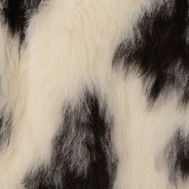 54% alpaca, 23% wool, 15% silk, 8% camel hair. Lining: 51% viscose, 49% cotton. Raey's exaggerated-shoulder, boxy bomber jacket is made from plush faux fur with a mottled ivory and black print