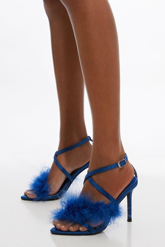 Feel party ready in our stiletto heels, with a tall heel, straps adorned with feather detailing, and a strappy design. Style them with jeans for an elevated look perfect for going seamlessly from day to night, or with a mini dress to polish off an occasion look. Feather Strap Stiletto Heel Slim Stiletto Heels Fluffy, Feather Detailing Secure Strappy Design Metallic Buckle Fastening at Ankle