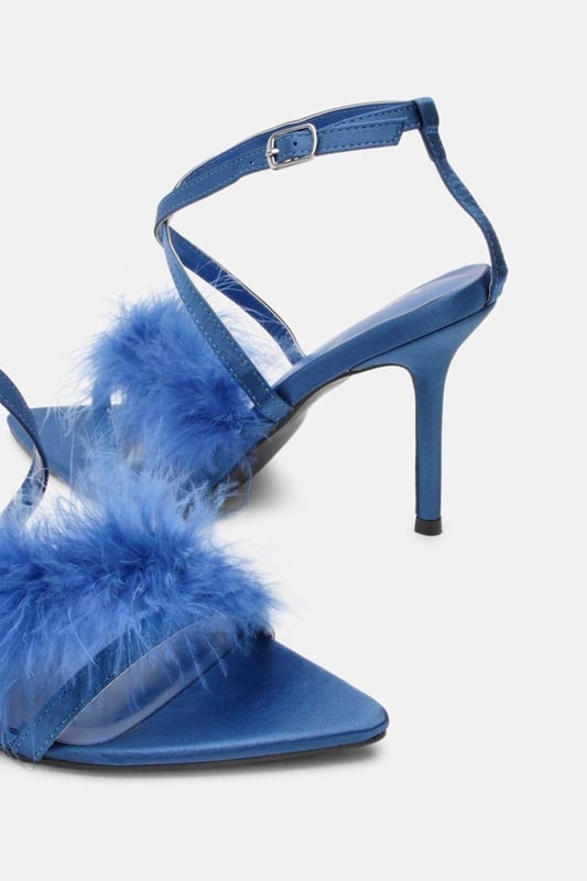 Feel party ready in our stiletto heels, with a tall heel, straps adorned with feather detailing, and a strappy design. Style them with jeans for an elevated look perfect for going seamlessly from day to night, or with a mini dress to polish off an occasion look. Feather Strap Stiletto Heel Slim Stiletto Heels Fluffy, Feather Detailing Secure Strappy Design Metallic Buckle Fastening at Ankle