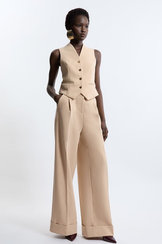 Elevate your top selection with our waistcoat, with a figure hugging fit, and buttons down the front. This piece pairs well with anything, from matching separates, to tailored trousers, to jeans for an elevated look that will take you seamlessly from day to night. Essential Tailored Button Through Waistcoat Classic Waistcoat Style V Neckline Fitted Silhouette Sleek, Minimal Design Button Front Fastening Matching Trousers Sold Separately