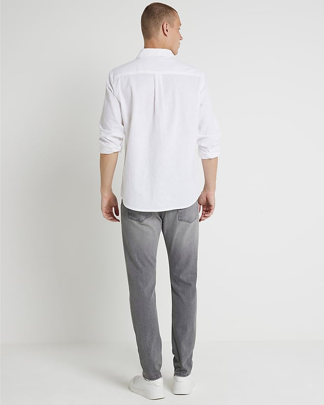 Skinny fit, Denim fabric, Classic 5 pockets, Belt loops, Button fastening, Cotton for this product has been more responsibly sourced