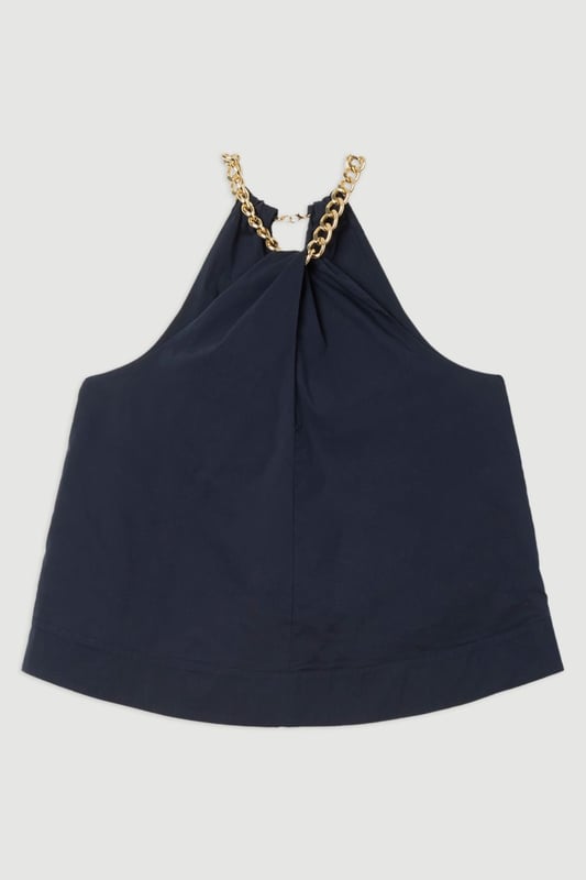 Striking halterneck design with bold chain detail Sleeveless silhouette for a breezy, summer-ready look Relaxed fit through the body for effortless comfort Keyhole detail at the neckline adds a touch of allure Versatile cotton-blend fabric suitable for various occasions  This Karen Millen plus size halter top is a must-have addition to your warm-weather wardrobe. The eye-catching chain detail at the neckline lends a touch of glamour to this otherwise casual piece, making it perfect for a variety of daytime events. Style it with high-waisted trousers and flat sandals for a chic look at family gatherings or weekend brunches. For a more laid-back approach, pair it with your favourite denim shorts and trainers for a day of shopping or a casual catch-up with friends. The relaxed fit and breathable fabric ensure all-day comfort, while the sleeveless design keeps you cool during those balmy summer days. This versatile top can easily transition from day to night - simply swap your flats for a pair of wedges and add some statement earrings for an effortless evening ensemble.