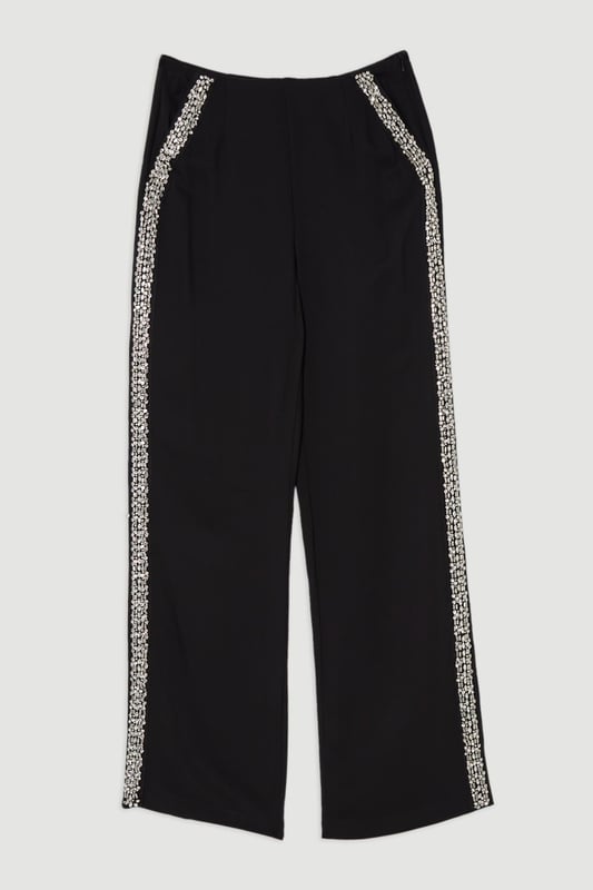 Experience sleek tailoring in a pair of straight leg trousers, with a flattering, relaxed fit and a comfortable high waistline. The sparkling embellishments are hand placed and make for a striking occasion look. Style it with the matching top for a co-ordinating look, or with a blazer and boots for a more laid back approach. Hand Embellished Cady Woven Trouser High Quality Tailored Design Comfortable High Waistline Flattering Straight Leg Fit Sparkling Hand Embellished Strip Down Sides Pocket Accents Matching Top Sold SeparatelyDiscover our collection of occasion wear or browse our range of women's occasion dresses now.