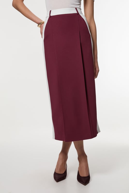 Experience updated tailoring essentials with our midi skirt, with a fitted silhouette and a high waistline, creating a universally flattering fit. The contrasting trims make for a bold outfit, especially when paired with the matching blazer for a striking office look.  Compact Stretch Contrast Waistband Pencil Midi Skirt High Quality Stretch Fabric Comfortable High Waistline Flattering Fitted Silhouette Contrasting Panel Detailing Thigh High Leg Split in Back Zip Back Fastening Matching Blazer Sold Separately