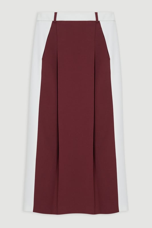 Experience updated tailoring essentials with our midi skirt, with a fitted silhouette and a high waistline, creating a universally flattering fit. The contrasting trims make for a bold outfit, especially when paired with the matching blazer for a striking office look.  Compact Stretch Contrast Waistband Pencil Midi Skirt High Quality Stretch Fabric Comfortable High Waistline Flattering Fitted Silhouette Contrasting Panel Detailing Thigh High Leg Split in Back Zip Back Fastening Matching Blazer Sold Separately