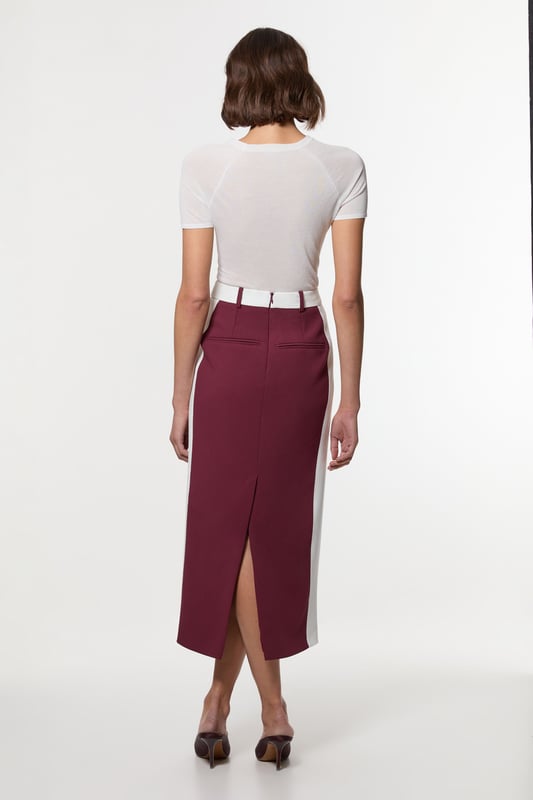 Experience updated tailoring essentials with our midi skirt, with a fitted silhouette and a high waistline, creating a universally flattering fit. The contrasting trims make for a bold outfit, especially when paired with the matching blazer for a striking office look.  Compact Stretch Contrast Waistband Pencil Midi Skirt High Quality Stretch Fabric Comfortable High Waistline Flattering Fitted Silhouette Contrasting Panel Detailing Thigh High Leg Split in Back Zip Back Fastening Matching Blazer Sold Separately