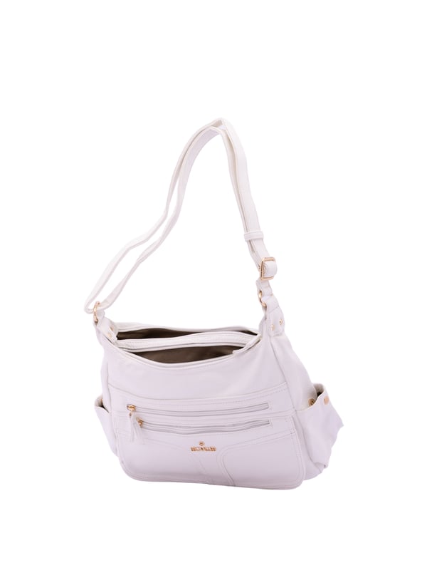 Bolso bandolera para mujer. El cierre es con cremallera. Los bolsillos internos son uno con cremallera y dos abiertos. Los bolsillos externos son dos frontales con cremallera, dos laterales con botón magnético y uno trasero con cremallera. Falta la correa para el hombro. El asa es regulable en ecopiel. Hay dos compartimentos internos. El material exterior es ecopiel. Internamente está forrado en poliéster. Medidas: 33x25x14 cm. Producto de moda