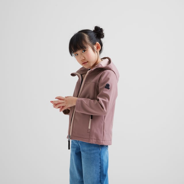 Active kids love our Koroma softshell jacket that gives protection from the elements, but doesn't restrict movement. Designed in Yorkshire, where we know just how changeable the weather can be, this versatile jacket has a durable, water resistant, windproof and fully breathable outer, a fixed, shaped, adjustable hood and a cosy, bonded inner fleece. Koroma has two handy zip pockets to keep all those essentials safe and a full length front zip with a chunky puller. It comes in dark and bright colours, so it works as a school coat and for weekends too. This lightweight jacket is finished with our signature embossed rubber Yorkshire Rose badge on the sleeve and a printed TOG24 logo on the chest.