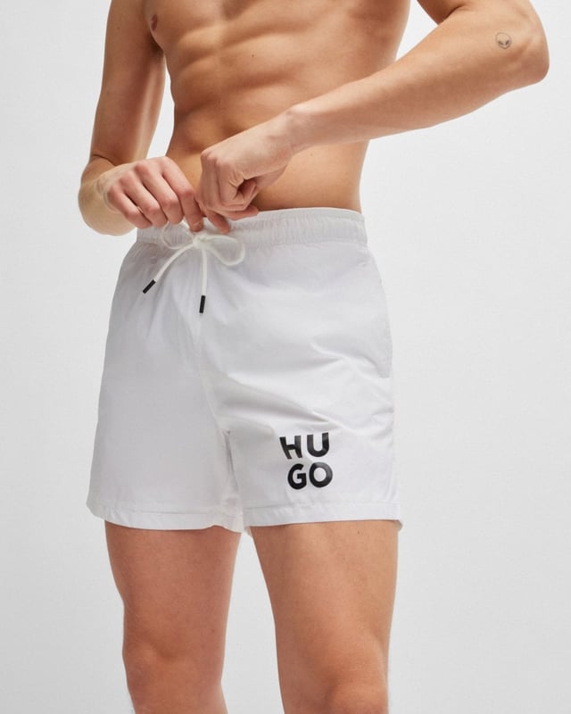 Sleek quick-drying swim shorts by HUGO Menswear. Featuring full lining and a drawcord waist, this pair is printed with a stacked HUGO logo. This product is created with recycled polyamide made from pre- and post-consumer textile waste or industrial fishing nets.
Material information: 100% Polyamid, Lining: 100% Polyester, Inner lining: 100% Polyester
50510190