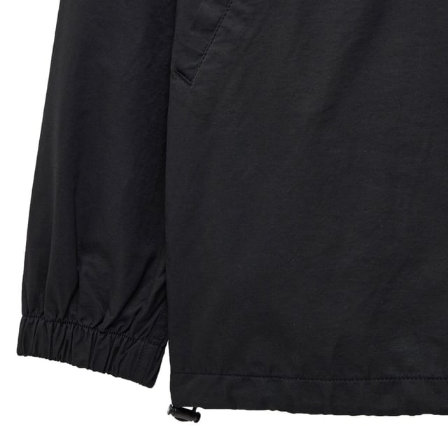 Mens Weekend Offender Piotti Smock Over-Top in black.- Three piece hood with adjustable  internal drawcord.- Centre front 1-4 zip with WO branded zip puller and zip guard.- Angled side entry welt pockets with concealed press stud fastening.- Elasticated cuffs.- Adjustable drawcord to hem.- Detachable WO badge to sleeve.- Regular fit.- Shell: 100% Cotton. Mesh Lining: 100% Polyester.- Ref: OTAW2401BK