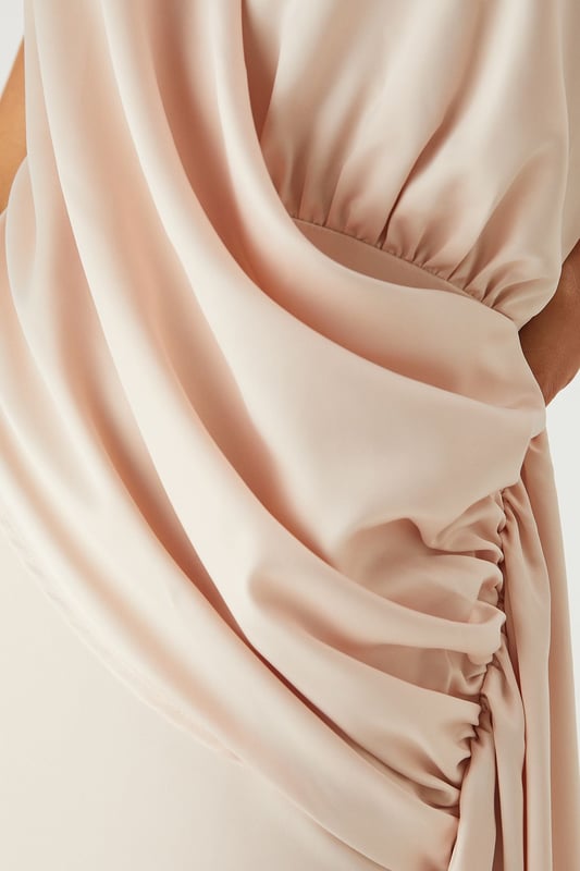 Luxurious satin fabric with a subtle sheen that catches the light beautifully
        Elegant halterneck design with an open back for a striking silhouette
        Sophisticated draped detailing along the side creates flattering movement
        Floor-sweeping maxi length with a daring side split for ease of movement
        Figure-enhancing fit with a smooth lining for comfort and confidence
    
    Command attention at your next special occasion in this show-stopping satin maxi dress from MissPap. The halterneck design frames your dcolletage whilst the open back adds a touch of drama to your ensemble. The expertly crafted side draping creates a flattering silhouette that flows with your every move, whilst the daring side split offers both practicality and allure. Style with strappy metallic heels as seen on our model and statement earrings for a head-turning look perfect for weddings, formal events or graduation ceremonies. For cooler evenings, pair with a delicate shawl or a tailored blazer to maintain the dress's elegant lines. This versatile piece transitions effortlessly from daytime celebrations to evening affairs, ensuring you remain the focal point of any occasion.
