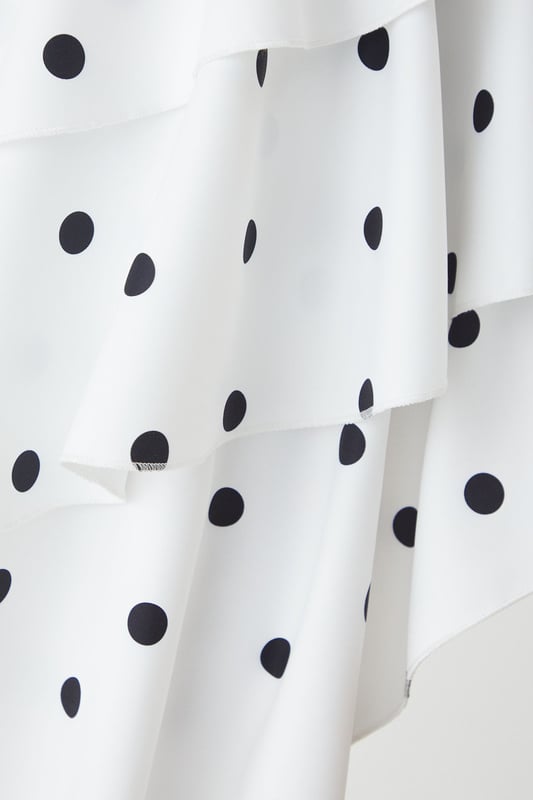 Striking sweetheart neckline with contrasting trim for a bold statement
        Asymmetric layered frill design creates dramatic movement and visual interest
        Elegant maxi length with high-low hemline for a contemporary silhouette
        Adjustable thin straps for a customised and secure fit
        Playful polka dot pattern adds a timeless charm to this occasion piece
    
    Make an unforgettable entrance in this show-stopping polka dot maxi dress from MissPap. The layered frill construction cascades beautifully to create a flattering asymmetric hemline that dances with your every move. The structured sweetheart neckline with its contrasting trim frames your dcolletage perfectly, whilst the fitted bodice cinches the waist for a feminine silhouette. Style with strappy heels and statement earrings as seen on our model for formal events such as weddings or race days. For evening soires, add a sleek clutch and a bold red lip to command attention. This versatile piece transitions effortlessly from daytime garden parties to evening celebrations - simply switch your accessories to reflect the occasion's formality. The lightweight woven fabric ensures comfort without compromising on sophistication.