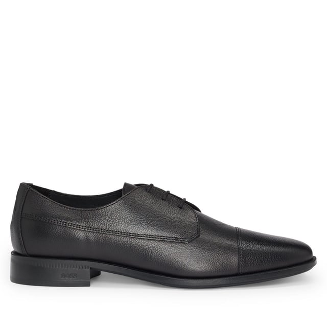 Men's Hugo Boss Colby Derby Shoes in Black Classic cap toe derby in grainy leather. Comfortable and versatile shoes born to perfectly match every business and formal outfit thanks to the clean design enriched by details like the double stitching on the quarter or the branding on the sole. Responsible product.