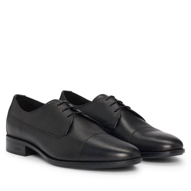 Men's Hugo Boss Colby Derby Shoes in Black Classic cap toe derby in grainy leather. Comfortable and versatile shoes born to perfectly match every business and formal outfit thanks to the clean design enriched by details like the double stitching on the quarter or the branding on the sole. Responsible product.
