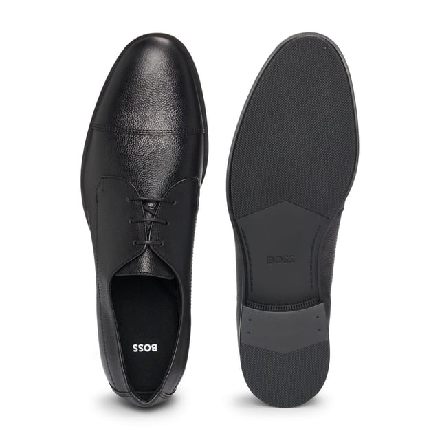 Men's Hugo Boss Colby Derby Shoes in Black Classic cap toe derby in grainy leather. Comfortable and versatile shoes born to perfectly match every business and formal outfit thanks to the clean design enriched by details like the double stitching on the quarter or the branding on the sole. Responsible product.