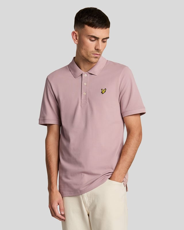 It’s a wardrobe essential that will be pulled out on weekends, dress down days at work, for nights out and even for days on the golf course. Our plain Lyle &amp; Scott polo shirt is such a classic that it barely needs an introduction. It’s made from cotton-blend jersey with a little added stretch. - Classic collar 
- Front button fastening 
- Short sleeves
- Composition: 97% cotton, 3% elastane