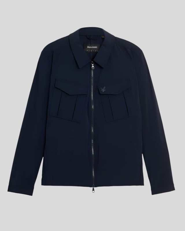 Style, quality and quintessentially British, Lyle & Scott  has over 100 years\' worth of technical expertise going into their products. Traditional garments have been given an injection of contemporary aesthetics but don\'t forget that iconic Golden Eagle logo, you\'re immediately recognised to be wearing a reputable brand.The Pocket Overshirt is an elevated version of a classic overshirt. Crafted from a durable blend of cotton and polyester. Featuring a pointed collar, full zip closure, twin chest pockets and buttoned cuffs. Finished with the iconic Golden Eagle logo embroidery on the chest.Regular Fit, Cotton Poly Blend, Pointed Collar, Full Zip Closure, Twin Chest Pockets, Buttoned Cuffs, Lyle & Scott Branding. Style & Fit:Regular Fit, Fits True to Size. Composition & Care:65% Polyester, 35% Cotton, Machine Wash.