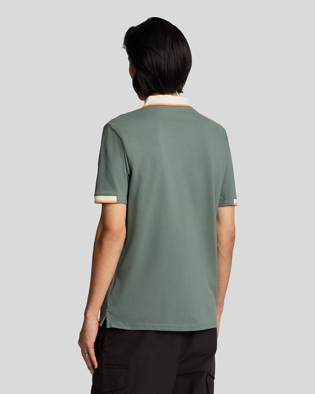 Elevate your spring menswear collection with the Half Tipped Polo Shirt, a quintessential piece that merges refinement and casual sophistication. Crafted with a premium blend of 97% cotton and 3% elastane, this shirt features meticulously designed half-tipped cuff sleeves and a stylish tipped collar, complemented by three elegant buttons. Adorned with a golden embroidered eagle on the left chest, it showcases a signature touch of luxury for the modern gentleman.

- Composition: 97% Cotton, 3% Elastane 
- Fit: Regular 
- Logo Branding: Golden embroidered eagle 
- Garment Location: Left chest 
- Styling Versatility: Perfect for both casual outings and refined gatherings 

Indulge in a garment that epitomizes elegance and versatility, making it a must-have addition to any discerning wardrobe this spring.