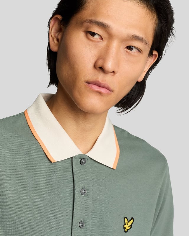 Elevate your spring menswear collection with the Half Tipped Polo Shirt, a quintessential piece that merges refinement and casual sophistication. Crafted with a premium blend of 97% cotton and 3% elastane, this shirt features meticulously designed half-tipped cuff sleeves and a stylish tipped collar, complemented by three elegant buttons. Adorned with a golden embroidered eagle on the left chest, it showcases a signature touch of luxury for the modern gentleman.

- Composition: 97% Cotton, 3% Elastane 
- Fit: Regular 
- Logo Branding: Golden embroidered eagle 
- Garment Location: Left chest 
- Styling Versatility: Perfect for both casual outings and refined gatherings 

Indulge in a garment that epitomizes elegance and versatility, making it a must-have addition to any discerning wardrobe this spring.