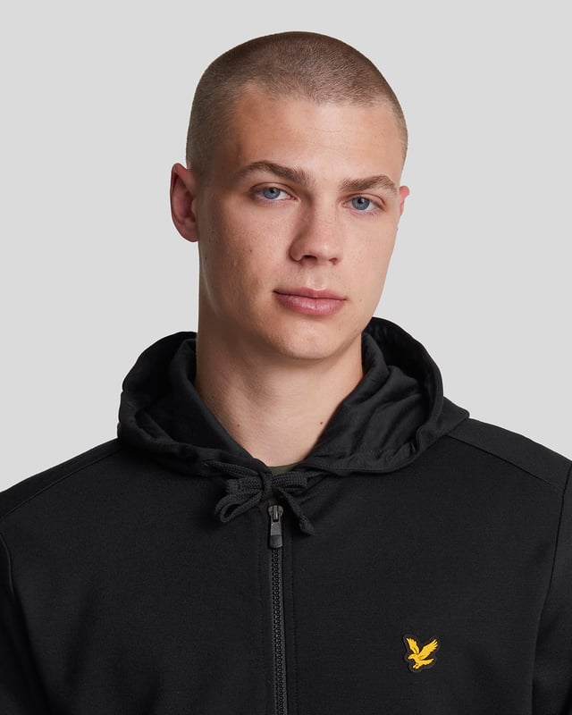 Unser Full-Zip Fly Fleece Hoodie aus leichter und weicher Viskose ist eine modernere, sportlichere Version des klassischen Zip-Up-Hoodies mit zusätzlichem Stretch.– 70 % Viskose, 22 % Polyamid, 8 % Elastan– Durchgehender, farblich abgestimmter Reißverschluss mit Gummispitze– Dicker Kordelzug– 360 g/m² Stoff– Locker geschnittene Bündchen und Saum– Eingesetzte Ärmel– Geteilte Kängurutasche