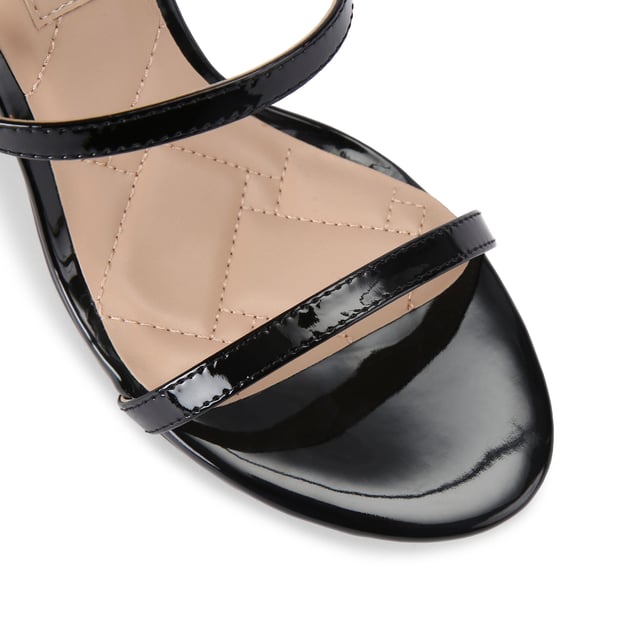 The Kurt Geiger Park Lane heel arrives in a black patent style. The heel is enclosed with gold buckle on the ankle strap as well as small gold branded stud detail at the heel. Heel height: 9.5cm.