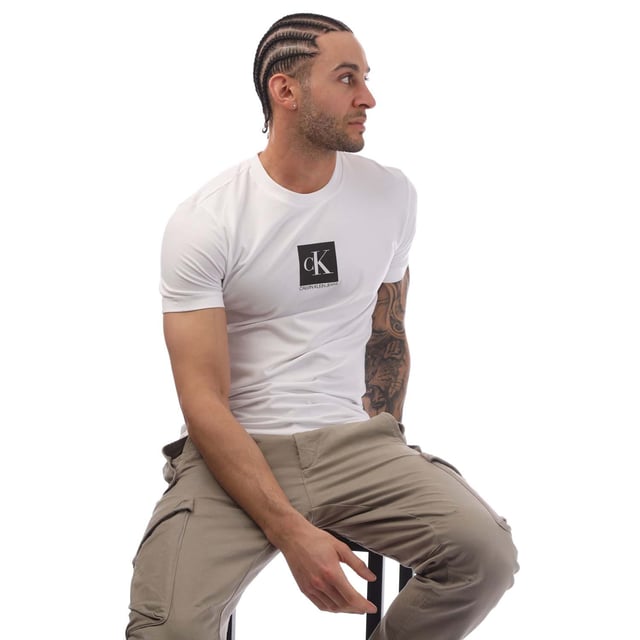 Mens Calvin Klein Jeans Slim Organic Cotton Logo T-Shirt in bright white.- Ribbed crew neck.- Short sleeves. - Calvin Klein monogram logo printed at centre chest.- Tonal Calvin Klein monogram logo at left cuff.- Soft organic cotton stretch jersey construction.- Slim fit. - 94% Organic cotton  6% Elastane.  Machine washable.- Ref: J30J314755YAF