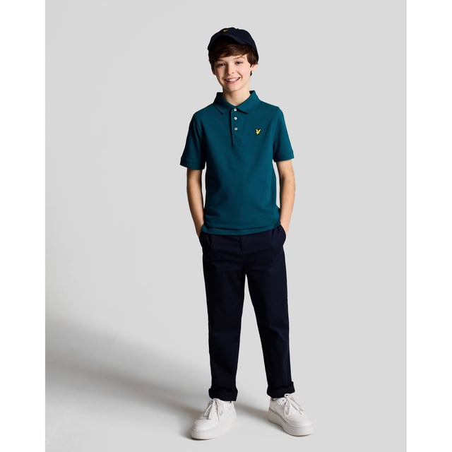Juniors Lyle And Scott Plain Polo Shirt in navy.- Classic ribbed collar.- Three button placket with detail stitching.- Short sleeves.- Ribbed cuffs.- Embroidered logo on chest.- Regular fit.- 97% Cotton  3% Elastane.- Ref: SPB2000VW992