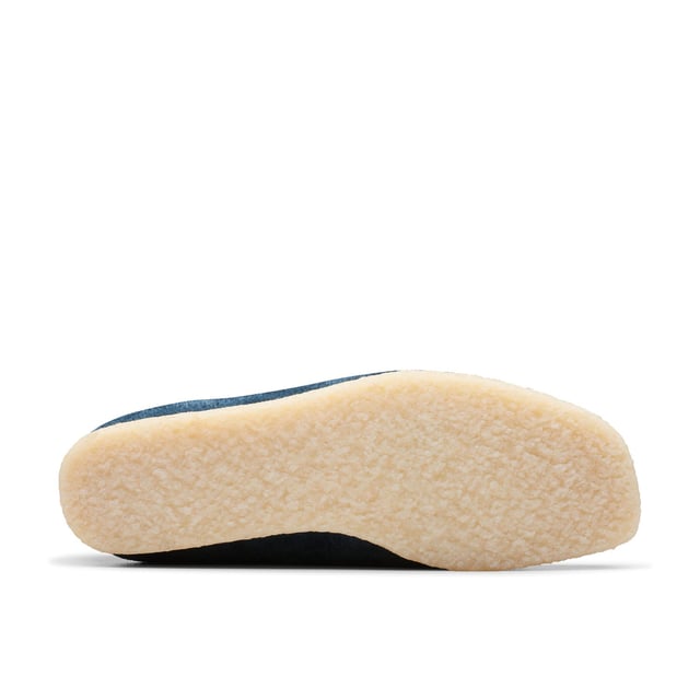 Clean  simple and timeless - our Originals icon is presented in navy and teal to lend a splash of colour to any look. Constructed with an Oasis suede upper from British tannery Charles F Stead  these Wallabees feature a white contrasting stitch on the apron between the vamp and the quarter. Taking you through morning  noon and night  this staple pair will style up every occasion.• CF Stead Oasis navy and teal suede uppers• Includes additional contrasting lace for versatile wear• Natural pebble crepe sole• Clarks Originals heat embossed metallic foil transfer on sock bed• Finished with two Clarks Originals fobs - Clarks Originals and WALLABEES• Moccasin construction