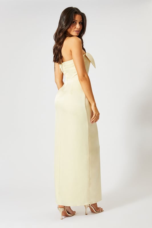 Striking halterneck design with an oversized bow detail for a dramatic entrance
        Luxurious satin fabric that catches the light beautifully as you move
        Figure-flattering maxi silhouette with a daring side slit for ease of movement
        Sleek, streamlined fit that contours to your body's natural shape
        Fully lined for comfort and a flawless drape that maintains its shape throughout wear
    
    Command attention at your next special occasion in this show-stopping satin maxi dress from Misspap. The statement halterneck with oversized bow detail creates a sophisticated yet eye-catching focal point, whilst the sleek column silhouette with side slit offers both elegance and practicality. Style with strappy heeled sandals as seen on our model for a refined evening look, or dress it up further with statement drop earrings and a clutch bag for formal events such as weddings or graduation ceremonies. The clean lines and timeless design make this dress a versatile addition to your occasion wardrobe that can be styled differently each time. Perfect for those moments when you want to feel confident, glamorous and utterly unforgettable - this is a dress designed to turn heads and create lasting impressions.