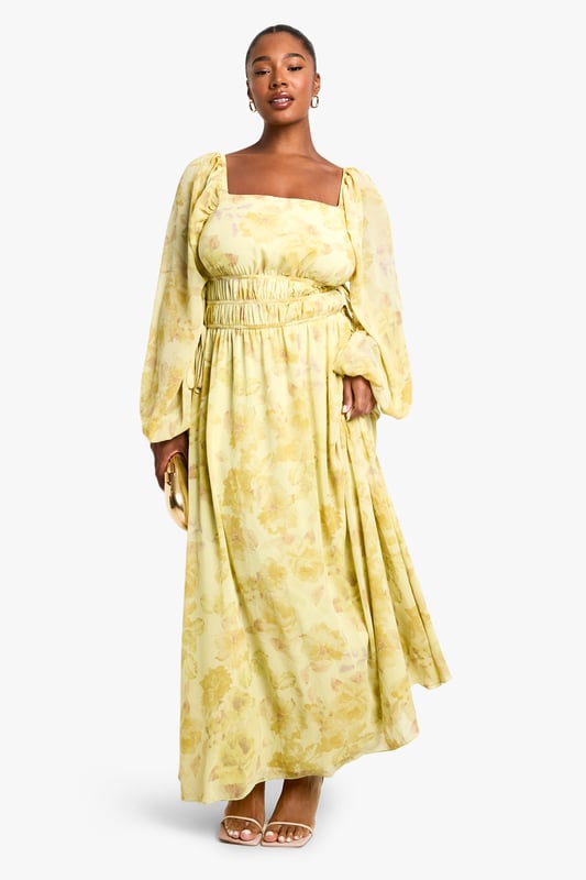 Elegant square neckline for a flattering dcolletage
        Flowing chiffon fabric with all-over pattern creates movement and drama
        Elasticated waist design offers comfortable fit and accentuates curves
        Statement balloon sleeves add contemporary flair to this classic silhouette
        Floor-sweeping maxi length perfect for making an entrance
    
    Make a striking impression in this captivating plus size maxi dress from Boohoo. The square neckline frames your dcolletage beautifully, whilst the elasticated waist creates definition and ensures all-day comfort. The billowing balloon sleeves add a touch of drama that's perfectly balanced by the flowing skirt. Style with strappy heels as seen on our model for an evening look that commands attention, or dress down with flat sandals for daytime sophistication. Add statement earrings and a clutch bag for drinks with the girls, or layer with a cropped jacket when the temperature drops. This versatile piece transitions effortlessly from summer garden parties to autumn evening events - simply adjust your accessories to suit the occasion.