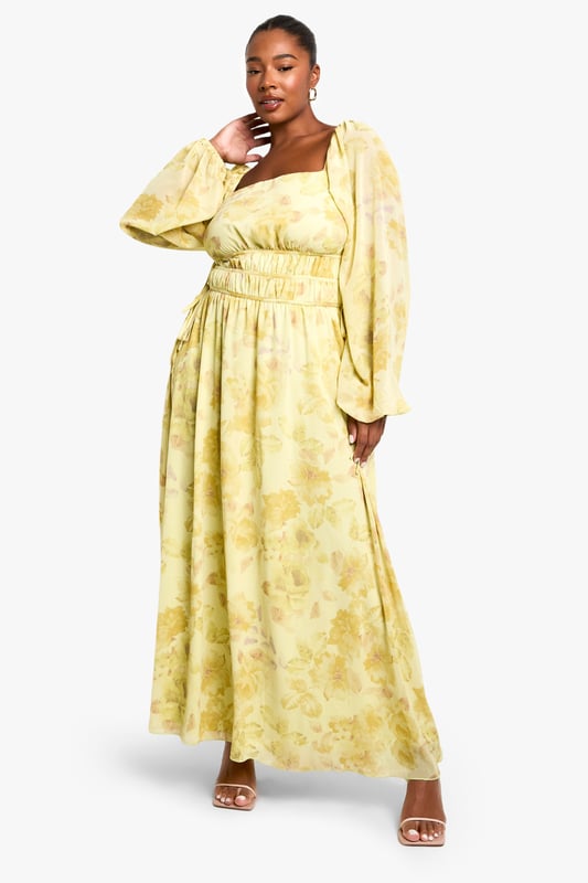 Elegant square neckline for a flattering dcolletage
        Flowing chiffon fabric with all-over pattern creates movement and drama
        Elasticated waist design offers comfortable fit and accentuates curves
        Statement balloon sleeves add contemporary flair to this classic silhouette
        Floor-sweeping maxi length perfect for making an entrance
    
    Make a striking impression in this captivating plus size maxi dress from Boohoo. The square neckline frames your dcolletage beautifully, whilst the elasticated waist creates definition and ensures all-day comfort. The billowing balloon sleeves add a touch of drama that's perfectly balanced by the flowing skirt. Style with strappy heels as seen on our model for an evening look that commands attention, or dress down with flat sandals for daytime sophistication. Add statement earrings and a clutch bag for drinks with the girls, or layer with a cropped jacket when the temperature drops. This versatile piece transitions effortlessly from summer garden parties to autumn evening events - simply adjust your accessories to suit the occasion.