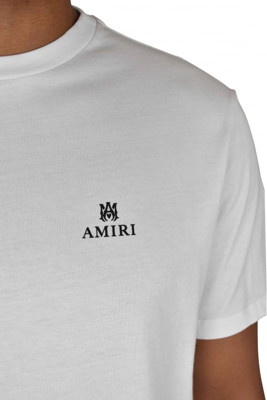 Camiseta Amiri de algodón blanco.Logotipo negro impreso en el pecho.Logotipo negro en la nuca.Cuello redondo.Mangas cortas.Made in Italy.