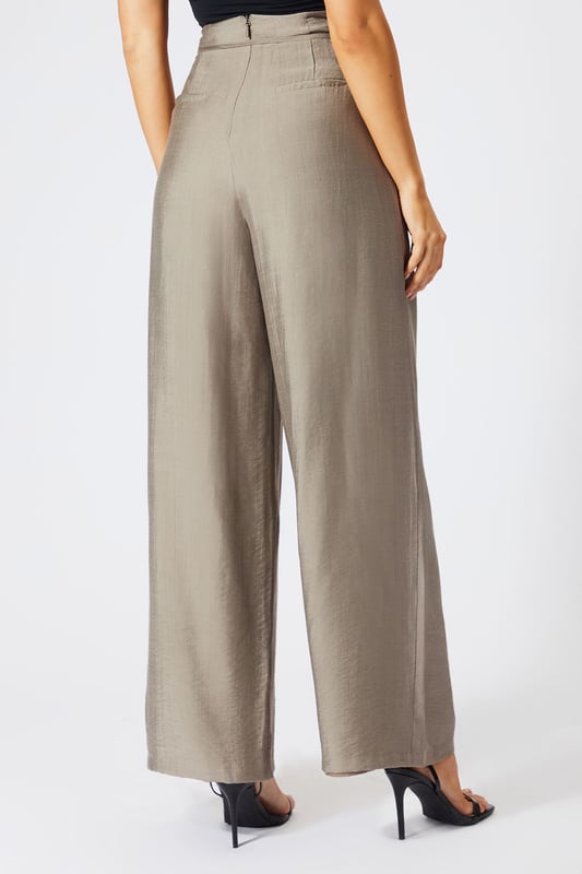 Striking paper bag waist design with self-tie belt for a customisable fit
        Wide leg silhouette creates a dramatic, flowing effect with every step
        High-waisted cut elongates the legs for a flattering profile
        Lightweight linen-look fabric offers breathable comfort for all-day wear
        Side pockets add practical functionality to this fashion-forward piece
    
    These wide leg trousers showcase MissPap's signature blend of comfort and contemporary style. The distinctive paper bag waist creates a gathered effect that cinches in your silhouette, while the flowing wide legs deliver movement and drama. Style them as seen with a one-shoulder bodysuit for casual gatherings, or dress them up with a cropped blouse and strappy heels for evening drinks with the girls. The versatile linen-look fabric transitions effortlessly between seasons-layer with an oversized blazer when temperatures drop or wear alone with a bandeau top during warmer months. Perfect for family brunches, shopping trips with mates, or casual Friday at the office, these trousers offer the ideal balance of relaxed comfort and head-turning style that MissPap devotees adore.