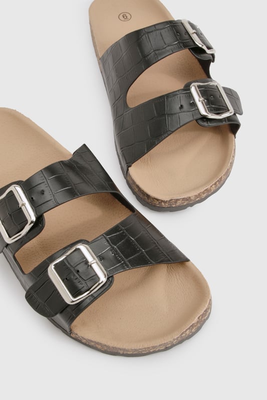 Double Buckle Croc Footbed Sliders We'll make sure your shoes keep you one stylish step ahead of the crowdWhether you're keeping it simple in sliders, living the high life in heels or joining the fash pack in flatforms, you'll be heading to shoe heaven with our fashion-forward footwear collection. Boots are your day-to-night bestfriend, giving a floral dress that tough twist - add a biker jacket for even more attitude. Find your summer feet in jelly sandals and enjoy balmy nights in block heels.
