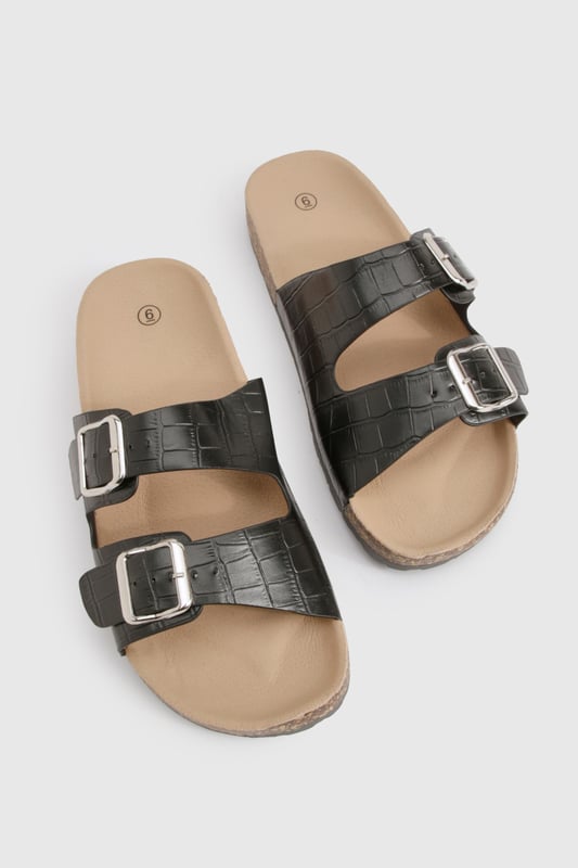 Double Buckle Croc Footbed Sliders We'll make sure your shoes keep you one stylish step ahead of the crowdWhether you're keeping it simple in sliders, living the high life in heels or joining the fash pack in flatforms, you'll be heading to shoe heaven with our fashion-forward footwear collection. Boots are your day-to-night bestfriend, giving a floral dress that tough twist - add a biker jacket for even more attitude. Find your summer feet in jelly sandals and enjoy balmy nights in block heels.