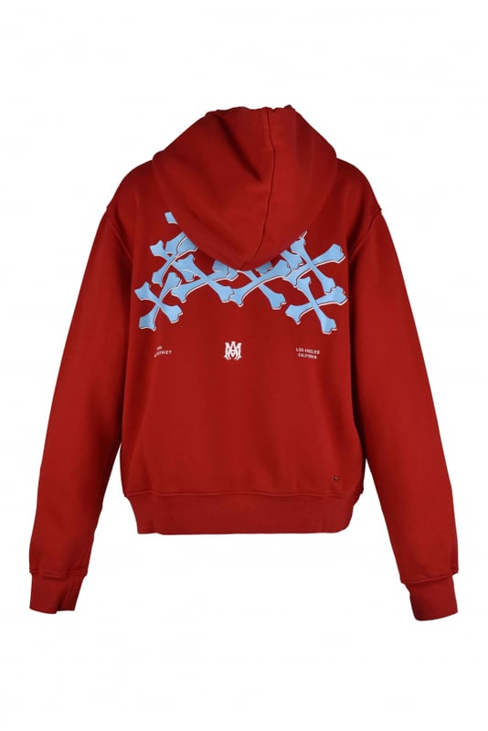 Sudadera con capucha Amiri de algodón rojo.Logotipo blanco estampado en el pecho.Estampado de huesos azul claro en la espalda.Bordes acanalados.Bolsillo canguro.Made in Italy.
