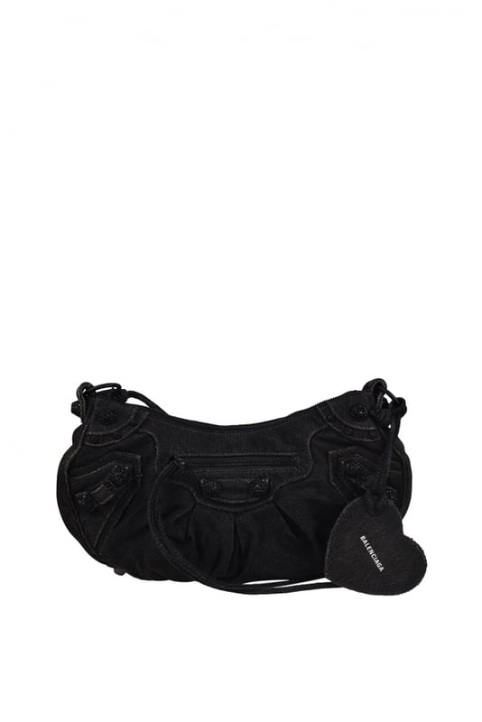 Bolso Balenciaga Cagole en lona vaquera negra.Efecto desteñido.Adorno de strass negro.Bandolera ajustable.Bolso de hombro.Cierre principal con cremallera.Bolsillo delantero con cremallera.Bolsillo trasero con cremallera.Espejo extraíble en forma de corazón.Dimensiones: 33 x 17 x 8 cm.Made in Italy.