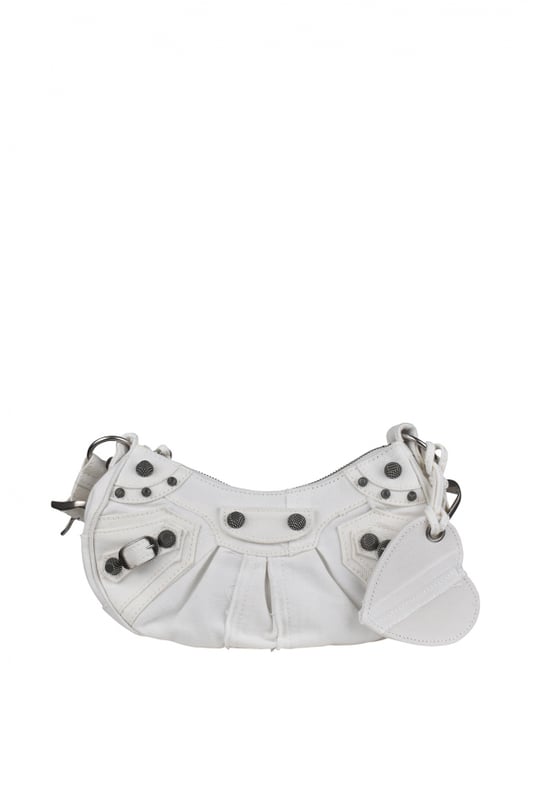 Bolso Balenciaga Cagole XS de lona vaquera blanca.Detalles metálicos plateados.Bandolera ajustable.Bolso de hombro.Cierre principal de cremallera.Espejo extraíble en forma de corazón.Dimensiones: 24 x 13 x 4,5 cm.Made in Italy.