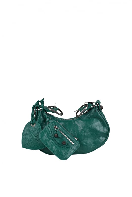Bolso Balenciaga Cagole de piel verde turquesa.Detalles metálicos plateados.Bandolera ajustable.Bolso de hombro.Cierre principal de cremallera.Espejo extraíble en forma de corazón.Pequeño monedero extraíble.Dimensiones: 24 x 13 x 4,5 cm.Made in Italy.