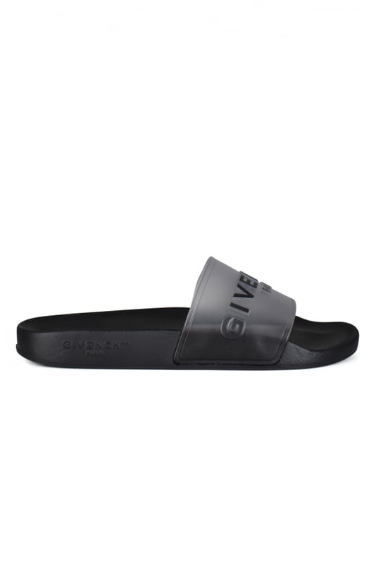 Chanclas negras Givenchy.Diseño translúcido. Logotipo negro impreso en la parte delantera.Suela plana de caucho.Made in Italy.